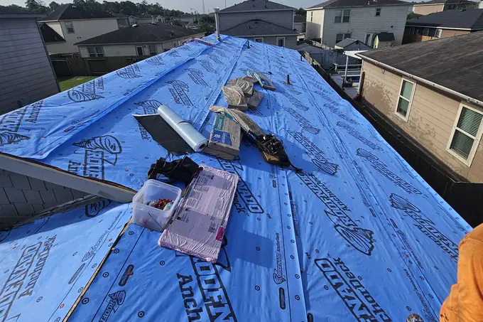 Roof underlayment with shingle bundles and installation supplies